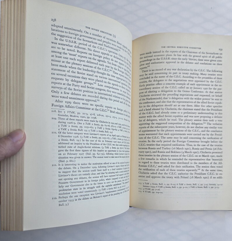 May include: Open book with text on the pages. The left page has the number 238 at the top. The text is in English and discusses the Soviet structure and foreign policy.