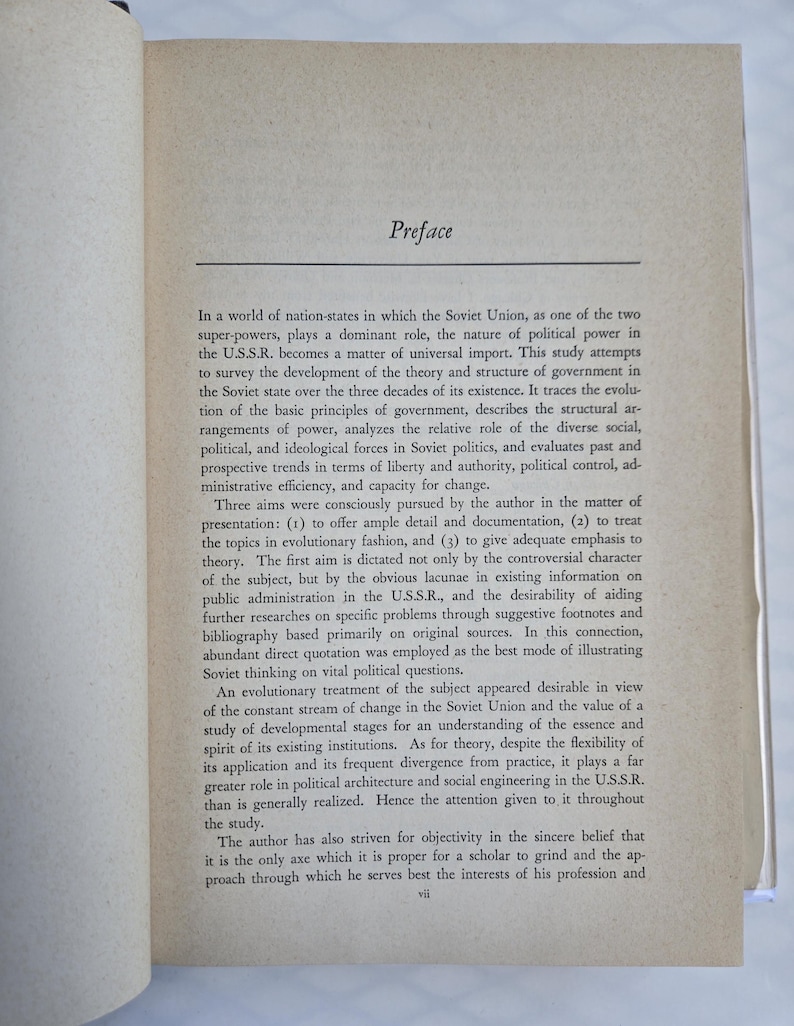 May include: Open book page with the title "Preface" at the top. The text is in black font on a light beige paper. The text describes the study of the Soviet Union's political power and government structure over three decades. The page is slightly angled.