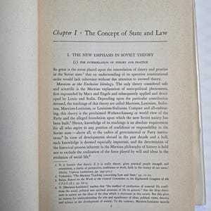May include: Open book with text. The page shows the title "Chapter I. The Concept of State and Law" and the subheading "1. THE NEW EMPHASIS IN SOVIET THEORY". The text discusses Marxism, Leninism, and Stalinism.