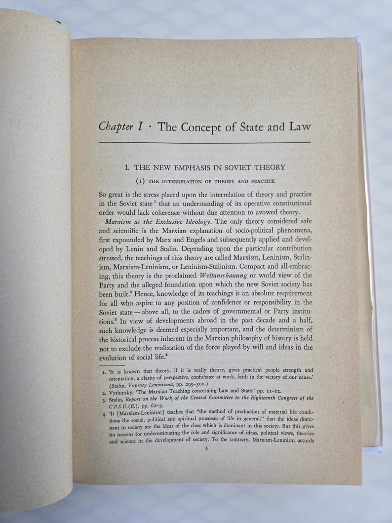 May include: Open book with text. The page shows the title "Chapter I. The Concept of State and Law" and the subheading "1. THE NEW EMPHASIS IN SOVIET THEORY". The text discusses Marxism, Leninism, and Stalinism.