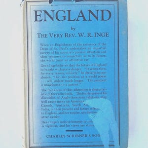 May include: A vintage book titled "ENGLAND" by The Very Rev. W.R. Inge. The cover is a faded blue with white text. The book discusses England's future and Anglo-American relations. Published by Charles Scribner's Son.