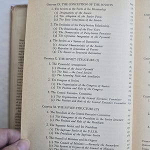 May include: Open book page with the table of contents for a book about the Soviets. The page is aged with text in black font. Chapters include "The Conception of the Soviets" and "The Soviet Structure."