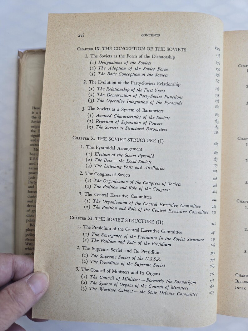 May include: Open book page with the table of contents for a book about the Soviets. The page is aged with text in black font. Chapters include "The Conception of the Soviets" and "The Soviet Structure."