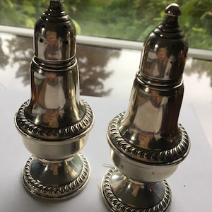 Vintage “Empire” sterling silver salt and pepper shakers