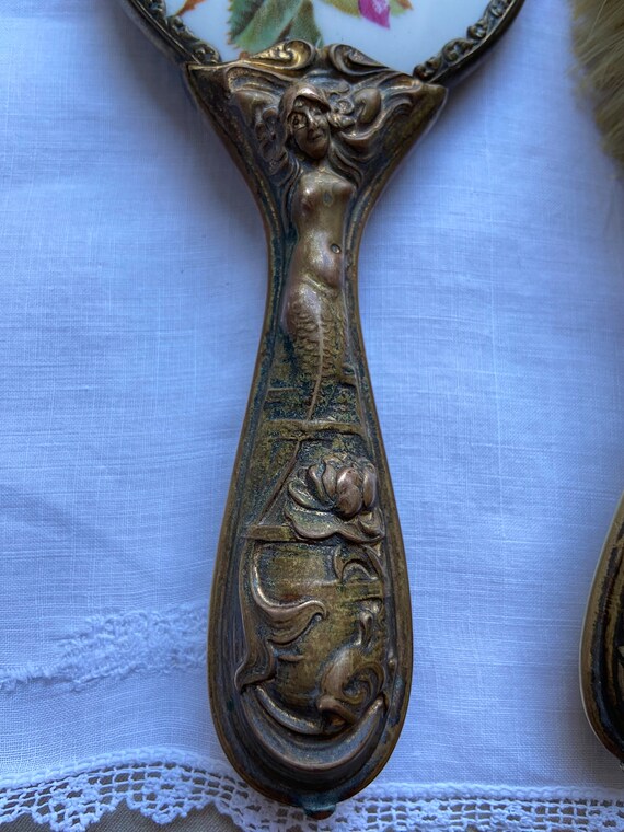 Antique hand mirror and brush set Gem