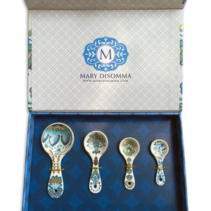 Mary DiSomma's boxed gift set of measuring spoons is the best gift for a serious baker or home cook. Comes in a beautifully decorated box with fabric tie.