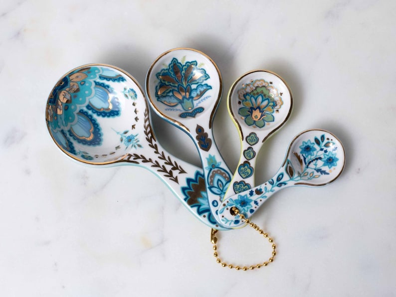 Nested ceramic measuring spoons gift set with floral print and gold details in Mary DiSomma's signature floral print design.