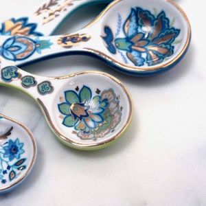 Closeup of beautiful and collectible ceramic measuring spoons from Mary DiSomma.