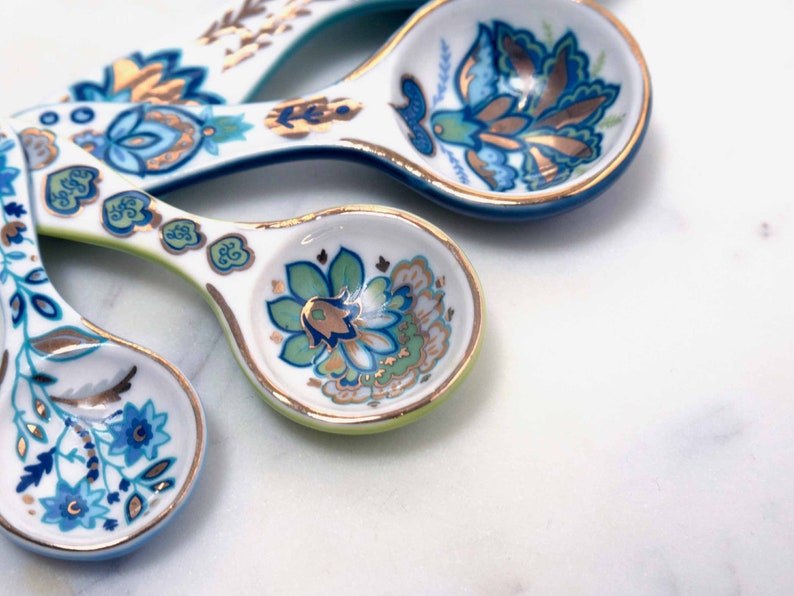 Closeup of beautiful and collectible ceramic measuring spoons from Mary DiSomma.