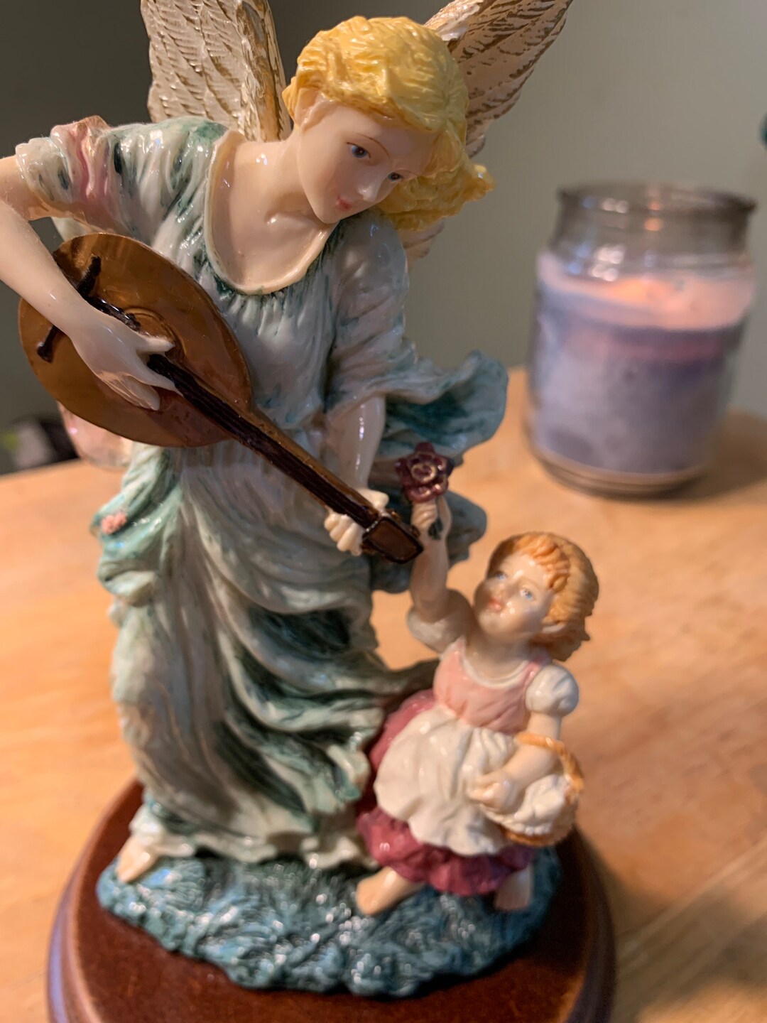 Large Angel Figurine Playing Instrument With Small Girl and Flower on