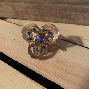Vintage Gold Flower Brooch with Blue Diamonds in Excellent Condition!