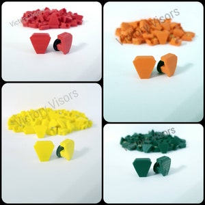 May include: Four sets of plastic diamond-shaped visor clips in red, orange, yellow, and green. Each set includes two clips.