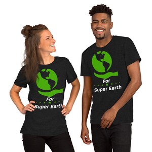 May include: Two people wearing black t-shirts with a green globe graphic and the text "For Super Earth".