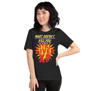 Ce qui ne vous tue pas donne toujours un t-shirt unisexe XP