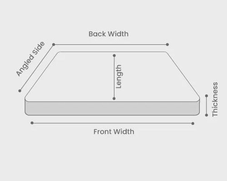 May include: Diagram showing a rectangular object with labels indicating dimensions: Angled Side, Back Width, Length, Front Width, and Thickness. The object is light grey on a light grey background. Black text labels.