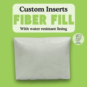 May include: White pillow insert filled with fiber fill. The insert has a water resistant lining. The text "Custom Inserts FIBER FILL With water resistant lining" is above the pillow insert. A water resistant icon is to the right of the pillow insert.