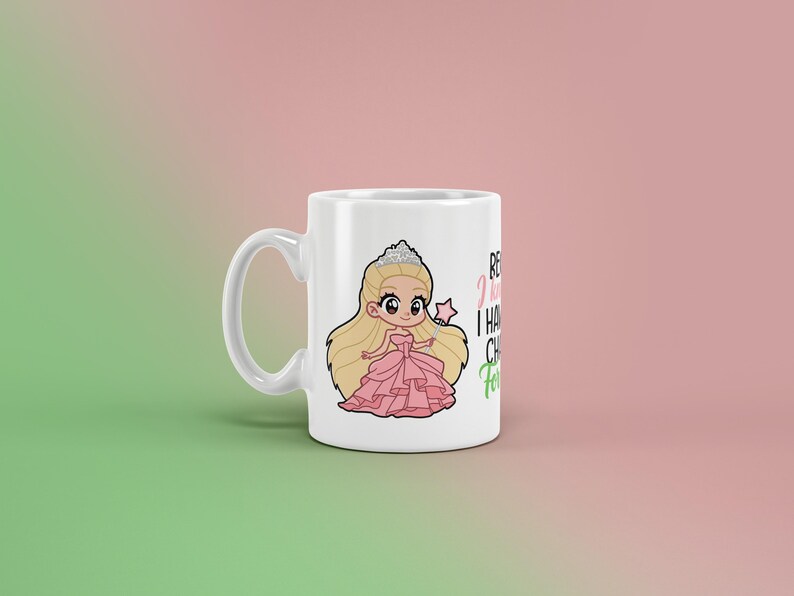 May include: White ceramic mug featuring a cartoon princess in a pink dress, tiara, and wand. The mug has the text "Because I have to, I have chores, for sure!" in black and green. A fun, whimsical design.