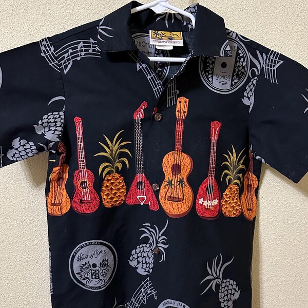 Kids Winnie Fashion Hawaiian Shirt ukulele, musical pineapple."A Song to Hawaii" Black, red, orange. Made in Hawaii.  Approx child size 5–6.