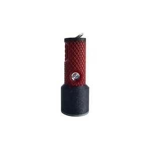 May include: A small, red and black flashlight with a textured grip and a key ring.