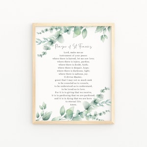 May include: A printable wall art print with a watercolor background of green leaves and a framed white text box containing the Prayer of St. Francis. The text reads: "Lord, make me an instrument of your peace: where there is hatred, let me sow love; where there is injury, pardon; where there is doubt, faith; where there is despair, hope; where there is darkness, light; where there is sadness, joy. O divine Master, grant that I may not so much seek to be consoled as to console, to be understood as to understand, to be loved as to love. For it is in giving that we receive, it is in pardoning that we are pardoned, and it is in dying that we are born to eternal life. Amen."