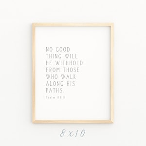 May include: A framed print with a white background and black text that reads "No good thing will he withhold from those who walk along his paths. Psalm 84:11". The frame is light brown wood and the print is 8x10 inches.