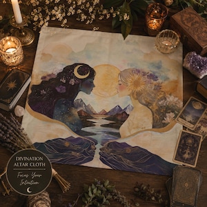 May include: A square altar cloth featuring a watercolor illustration of two figures facing each other, one with dark hair and a crescent moon, the other with light hair and a sun, separated by a river and mountains under a large golden sun.