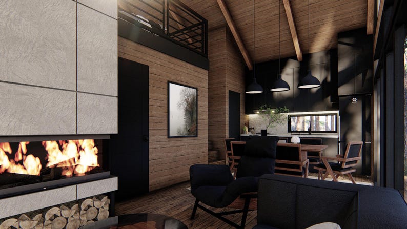May include: Interior view of a modern cabin with a fireplace, wooden walls, and a loft. The living area features a black armchair, a sofa, and a dining table. The kitchen has black cabinets and pendant lights. A framed artwork hangs on the wall.