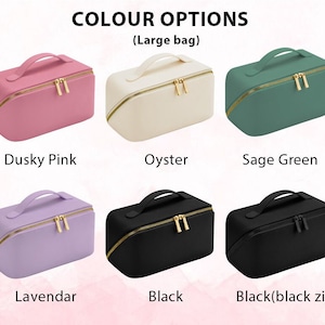 May include: Cosmetic bags in various colors: dusky pink, oyster, sage green, lavender, and black. Each bag has a gold zipper and a handle. The text "COLOUR OPTIONS (Large bag)" is displayed above the bags.