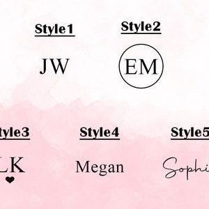 May include: Five different styles of personalized name or initials for a monogram. Style 1 shows the initials "JW" in a simple font. Style 2 shows the initials "EM" in a circle. Style 3 shows the initials "LK" with a heart below. Style 4 shows the name "Megan" in a simple font. Style 5 shows the name "Sophia" in cursive.