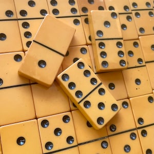 Vintage Bakelite butterscotch dominos lot of 56. NOT a complete set