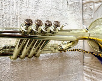 vintage Golden Trumpet toy instrument.