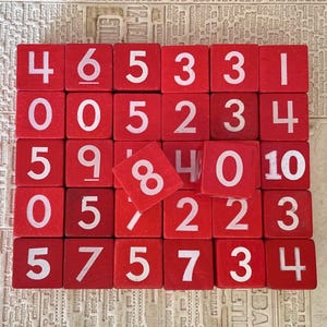 Vintage red wooden dice, lot of 31.