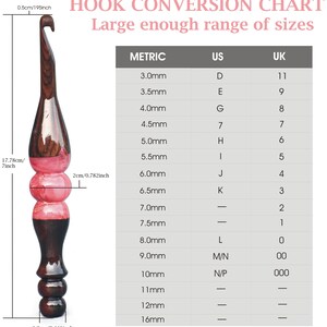 May include: A chart showing crochet hook sizes in millimeters, US sizes, and UK sizes. The chart is printed on a white background. A wooden crochet hook is shown next to the chart.