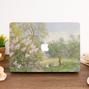 Puede incluir: Una funda para portátil con una pintura de acuarela de una persona y un perro relajándose en un campo de flores moradas.