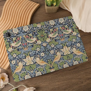 May include: A tablet case featuring a detailed floral and bird pattern in shades of blue, green, and cream. The design includes stylized birds, flowers, and berries, creating a vintage aesthetic. The case is designed to fit a tablet.