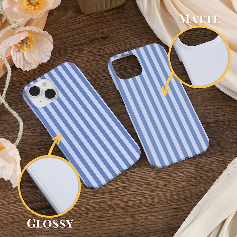 May include: Two phone cases with a blue and white striped pattern. The case on the left is labeled "Glossy" and the case on the right is labeled "Matte".