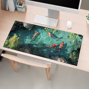 May include: A colorful mousepad with a design of orange and white koi fish swimming in a pond with green lily pads and leaves.
