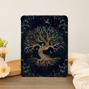 May include: A gold tree of life with intricate roots and branches against a dark blue background with sparkling stars and green leaves. The tree is surrounded by a swirling vine pattern.