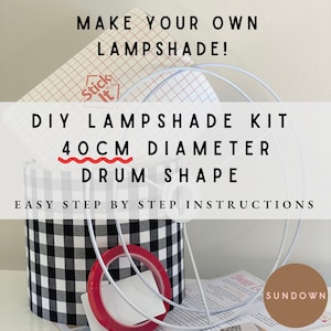 May include: DIY lampshade kit with easy step-by-step instructions. The kit includes a 40 cm diameter drum-shaped frame, fabric, and adhesive. The fabric is black and white gingham.