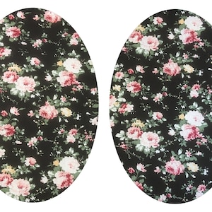 Könnte beinhalten: Zwei ovale Stoffmuster mit schwarzem Hintergrund und einem floralen Muster in den Farben Rosa, Weiß und Gelb.