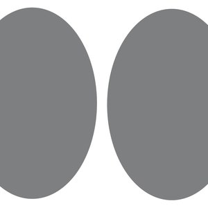 May include: Two grey circles side by side.