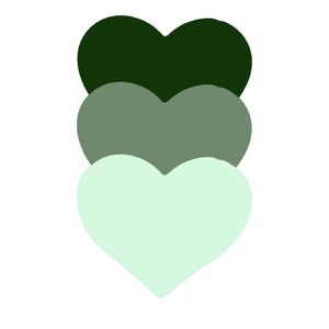 Peut inclure: Trois cœurs empilés dans des tons de vert. Le cœur du haut est vert foncé, le cœur du milieu est vert moyen et le cœur du bas est vert clair.