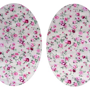 May include: Two oval-shaped fabric patches with a beige background and a pink and burgundy floral pattern.