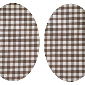 Könnte beinhalten: Zwei ovale Platzsets in braunem und weißem Gingham-Muster. Die Platzsets sind aus gewebtem Stoff mit einem karierten Muster.