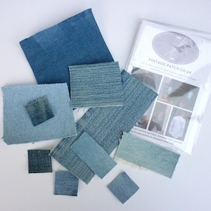 May include: Assortment of blue denim fabric patches in various sizes and textures. The patches are arranged on a white surface with a white paper bag labelled "Vintage-Patch.co.uk".
