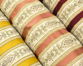 Damask upholstery fabric with gold, pink, burgundy, and green stripes. Sold by the meter (multiples of 50 cm: 1 = 50 x 140 cm; 2 = 100 x 140 cm, etc.)
