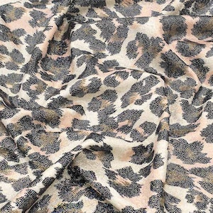 Stretchy leopard print fabric with glitter for costumes, leotards, tracksuits, dance performances, gymnastics and clothing