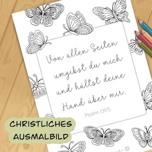 Könnte beinhalten: Eine weiße Ausmalvorlage mit Schmetterlingsillustrationen und dem Text "Von allen Seiten umgibst du mich und hältst deine Hand über mir. Psalm 139.5". Die Worte "CHRISTLICHES AUSMALBILD" sind ebenfalls vorhanden. Farbstifte sind sichtbar.