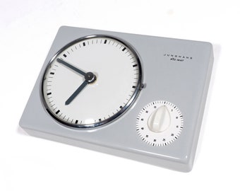 Junghans Ato-Mat battery-operated mid century wall clock with glazed ceramic case and signal clock, 1960s