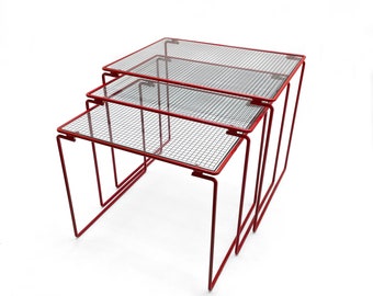 Beautiful vintage set of three red metal & glass Nesting Tables from the 1980s